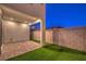 Small backyard with artificial turf and brick pavers at 642 Angel Aura St, Las Vegas, NV 89138