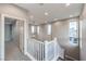 Upstairs hallway with light walls and carpet flooring at 642 Angel Aura St, Las Vegas, NV 89138