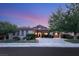 Stunning house exterior at dusk, showcasing a spacious driveway at 12 Canoa Hills Dr, Henderson, NV 89052