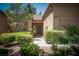 Tan two-car garage home with walkway and landscaping at 9433 Grand Mesa Dr # 0, Las Vegas, NV 89134