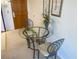 Small dining area with glass-top table and two chairs at 555 Highland Dr # 223, Mesquite, NV 89027