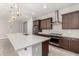 Kitchen with dark wood cabinets, stainless steel appliances and an island at 5916 Yellow Ridge Ave, Las Vegas, NV 89131