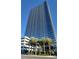 Modern high rise building with palm trees at 4471 Dean Martin Dr # 2205, Las Vegas, NV 89103