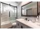 Modern bathroom with a walk-in shower, bathtub, and stylish vanity at 7880 Dana Point Ct, Las Vegas, NV 89117