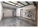 Garage with an epoxy floor, storage cabinets, and wall-mounted bicycle storage at 7880 Dana Point Ct, Las Vegas, NV 89117