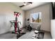 Compact home gym featuring cardio and weight training equipment at 7880 Dana Point Ct, Las Vegas, NV 89117