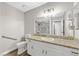 Bathroom with granite countertop, white cabinets and a shower at 5135 Brownwood Ave, Las Vegas, NV 89122