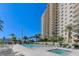 Inviting community pool and spa at the base of a high-rise condominium building at 8255 S Las Vegas Blvd # 1521, Las Vegas, NV 89123