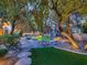 Landscaped backyard with pool and waterfall feature at 1 Quail Run Rd, Henderson, NV 89014