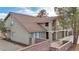 Elevated view of a two-story home with a tile roof and brick retaining wall at 5410 S Mojave Rd, Las Vegas, NV 89120