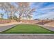 Backyard putting green surrounded by desert landscape at 5410 S Mojave Rd, Las Vegas, NV 89120