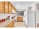 Bright kitchen featuring wood cabinets and granite countertops at 3597 Arville St # 201C, Las Vegas, NV 89103