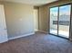 Bedroom with sliding glass door leading to a balcony at 11816 River Hawk Ave, Las Vegas, NV 89138