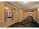 Long hallway with carpet and access to rooms at 135 E Harmon Ave # 3809&3811, Las Vegas, NV 89109