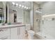 Modern bathroom with a large walk-in shower and white cabinetry at 10309 Saugus Dr, Las Vegas, NV 89134