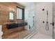 Spa-like bathroom with floating vanity, walk-in shower, and wood features at 6876 Milos Rd, Las Vegas, NV 89118