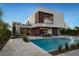 Modern home with a pool and landscaped backyard at 6876 Milos Rd, Las Vegas, NV 89118