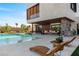 Stunning pool with outdoor lounge and built-in BBQ at 6876 Milos Rd, Las Vegas, NV 89118