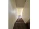 Indoor view of carpeted staircase leading to upper level at 5969 High Steed St # 101, Henderson, NV 89011