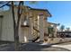 Building exterior with covered entryway, stairs, and landscaping with trees at 4451 Rich Dr # D, Las Vegas, NV 89102