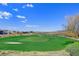 Scenic golf course with putting green and mountain views at 605 Saint Croix St, Henderson, NV 89012