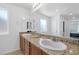 Close-up of a double vanity with granite countertops in a bathroom at 3929 E Weld Ave, Pahrump, NV 89061