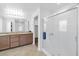 Bathroom with double vanity, glass shower doors, and tiled flooring at 3929 E Weld Ave, Pahrump, NV 89061