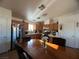 Kitchen with an island, dining area and wood cabinets at 457 E Merlayne Dr, Henderson, NV 89011