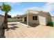 Backyard patio with covered seating area and grassy area at 2958 Kensington St, Las Vegas, NV 89156