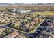 Aerial perspective of neighborhood, showcasing homes and nearby school at 10038 Peak Lookout St, Las Vegas, NV 89178