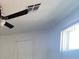 Simple bedroom with ceiling fan and window at 2137 E Saint Louis Ave, Las Vegas, NV 89104