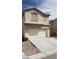 Two-story house with attached garage and neutral color scheme at 3644 Starlight Evening St, Las Vegas, NV 89129