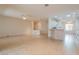 Open living room with tile floors and a view into the kitchen at 2060 Crown View St, Henderson, NV 89052