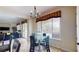 Bright dining area with glass table and chairs, adjacent to kitchen at 3425 Fledgling Dr, North Las Vegas, NV 89084