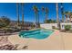 Clean lines and a refreshing blue pool surrounded by desert landscaping at 2063 Sapphire Valley Ave, Henderson, NV 89074