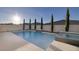 Sparkling pool and jacuzzi with surrounding landscaping at 3152 Tronzano Ave, Henderson, NV 89044