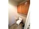 Small bathroom with toilet and wood cabinet at 3378 Pheasant Canyon Way # 1003, Laughlin, NV 89029