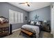 Charming bedroom with a rustic bed and window shutters at 1440 E Gamebird Rd, Pahrump, NV 89048