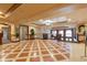 Upscale lobby with tiled floors, elegant seating, and high ceilings at 30 Strada Di Villaggio # 248, Henderson, NV 89011