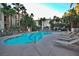 Community pool and spacious deck with lounge chairs at 7173 S Durango Dr # 310, Las Vegas, NV 89113