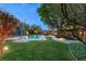 View of a refreshing pool and spa with a ladder and surrounding lawn at 2001 Silver Ave, Las Vegas, NV 89102