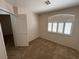 Bright bedroom featuring a window with plantation shutters at 730 Goshawk St, Henderson, NV 89015