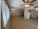 Living room with kitchen and ceiling fan at 730 Goshawk St, Henderson, NV 89015