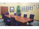 Boardroom with large table and purple chairs at 7925 Fantail Dr, North Las Vegas, NV 89084