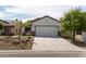 One-story house with white exterior and a two-car garage at 7925 Fantail Dr, North Las Vegas, NV 89084