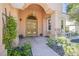 Elegant double doors and arched entryway leading into the home at 2951 Aruba Ct, Las Vegas, NV 89121