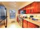 Well-equipped kitchen with wood cabinets and granite countertops at 2451 N Rainbow Blvd # 2146, Las Vegas, NV 89108