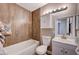 Updated bathroom with wood-look tile and new vanity at 2708 Royal St, North Las Vegas, NV 89030