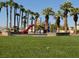 Community playground with playset and grassy area at 4848 Califa Dr, Las Vegas, NV 89122