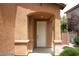 Front entrance with a covered porch and a light fixture at 6528 Chebec St, North Las Vegas, NV 89084